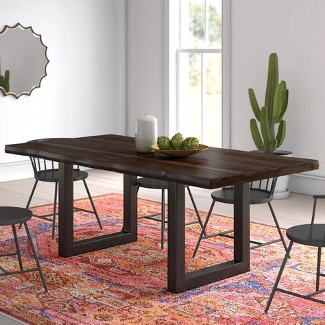 This dining table brings transitional style to your dining room with it's rustic and industrial design. It features two metal sled legs in a black finish for an open, minimalist silhouette. The tabletop is made from solid sheesham wood with natural wood grain for a hint of rustic charm. Plus, it's finished with a live edge for added rustic, farmhouse design. This table measures 80" long, so you can sit eight people comfortably to share a bite to eat. Butterfly Leaf Table, Metal Base Dining Table, Dining Table Wood, Trestle Dining Tables, Extension Dining Table, Solid Wood Table, Sheesham Wood, Table Wood, Solid Wood Dining Table