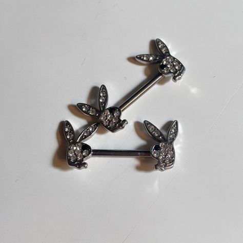 playboy nipple barbells Playboy Jewelry, All Gems, Piercing Jewelry, Earings Piercings, Tattoos And Piercings, Piercings, Gems, Tattoos, Jewelry Watches