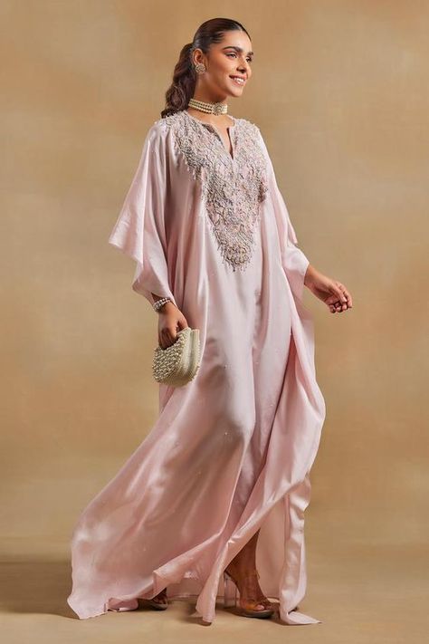 Baby pink kaftan, highlighted with beads, crystal embellished yoke and chantilly lace detailing.
Components: 1
Pattern: Embellished
Type Of Work:  Beads, Crystals
Neckline: Notched Neck
Sleeve Type: Three Quarter Sleeves
Fabric: Habutai Silk, Chantilly Lace
Color: Pink
Other Details: 
Model height: 5ft 8inches, wearing size M
Note: The bag shown in the image is not for sale

Occasion: Sangeet - Aza Fashions Latest Kaftan Designs, Pink Kaftan, Kaftan For Women, Kaftan Designs, Silk Kaftan, Designer Party Wear Dresses, Indian Clothes, Dresses Ideas, Chantilly Lace