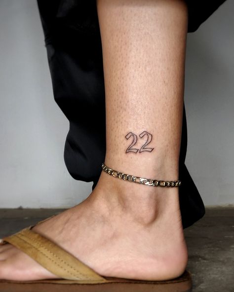 Number 22 Handpoked on the ankle in modified old English font. No machines used, all poked by hand. The number 22 is only an outline and done on the exterior of the left ankle. Leg Number Tattoo, Number 22 Tattoo, Old English Tattoo, 22 Tattoo, Number Tattoos, English Font, Number 22, Old English Font, Hand Poked Tattoo