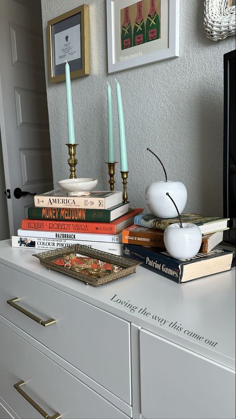 Books On Dresser Bedrooms, Candle On Dresser, Tv Stand Decor Aesthetic, How To Style Books, Top Of Dresser Decor Bedroom Ideas, Dresser Display Ideas, Books On Dresser, Dressor Decor, Top Of Dresser Decor Bedroom