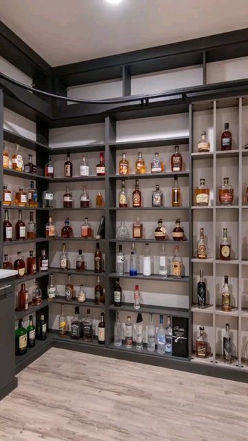 Closet Factory Colorado on Instagram: "Smooth and sweet is right! A custom whiskey room that dreams are made of! Design by: Cindy Schumacher Photos by: @libbie_martin #whiskey #tennessee #display #customstorage #closetgoals #closetorganization #closetfactory #denvercolorado #denverdesign #interiordesign #makeover #beforeandafter #mudroom #wallbed #pantry #garage #homeoffice #organize #homeorganization #refresh #trending #coloradolife" Whiskey Closet, Pantry Garage, Closet Factory, House Basement, Library Bar, Whiskey Room, Basement House, Custom Storage, Wall Bed