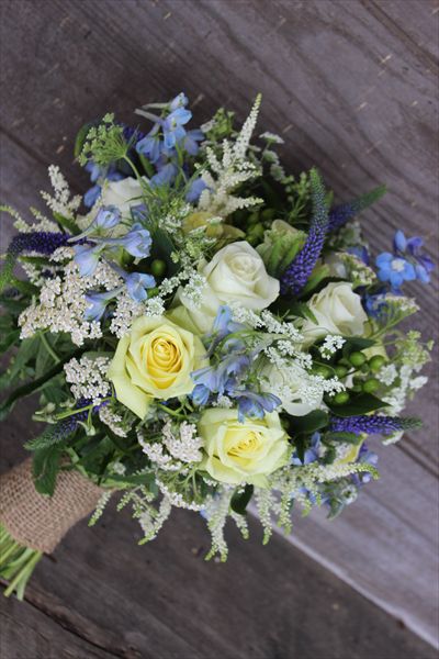 white yellow and blue bouquet  Four Leaf Clover Designs - Lehigh Valley/Poconos Four Leaf Clover Bouquet, Blue And Yellow Wedding Flowers, Light Blue And Yellow Wedding Flowers, Blue White And Yellow Bouquets, White Yellow And Blue Flowers, Galactic Wedding, Blue And Yellow Bridal Bouquet, Blue And Yellow Bouquet, Yellow And Blue Bouquet