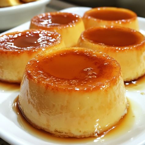 🍮 Delight in Puto Flan—fluffy steamed rice cakes topped with creamy caramel custard. A perfect sweet treat! 😍🍰 #PutoFlan #FilipinoDesserts Puto Flan Ingredients: Rice flour (1 cup) Sugar (1/2 cup) Baking powder (1 tsp) Milk (1 cup) Eggs (2) Condensed milk (1/2 cup) Caramel syrup (1/4 cup) Instructions: Mix rice flour, sugar, and baking powder. Add milk and eggs; blend well. Pour into molds, add a layer of caramel syrup. Steam for 20-25 minutes or until set. 🍮💛 Puto Flan combines rich cara... Flan Aesthetic, Mini Flan, Caramel Custard, Steamed Rice Cake, Cream Caramel, Instagram Recipes, Creamy Caramel, Random Aesthetics, Halo Halo