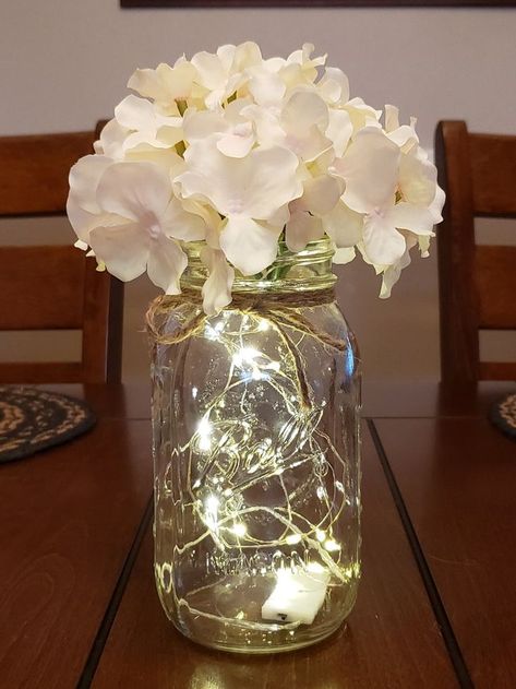 Mason Jar With Lights, Jar With Lights, Wedding Centerpieces Mason Jars, Fairy Lights Wedding, Lighted Centerpieces, 50th Wedding Anniversary Party, Senior Ideas, Jar Centerpieces, Moms Birthday