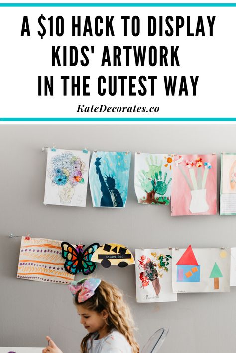 If you're wondering how to display kids wall art at home on the cheap, this quick, $10 wall art display hack is THE most genius solution. Never worry about how to display kids art again ... and your kids will be so thrilled to see all their gorgeous artwork displayed proudly in your home! #kidsdecor #kidsart #kidscrafts #kidsroom #kidsroomdecor #kidsartprojects #homedecor #easydiy Display Kids Artwork In Playroom, Cork Board Kids Art Display, Kids Art Display Cable, How To Hang Kids Art On Wall, Hanging Kids Artwork On The Wall, Kids Art Display Wall Hanging Artwork, Diy Art Display Kids, Kid Art Work Display, Toddler Art Display Ideas