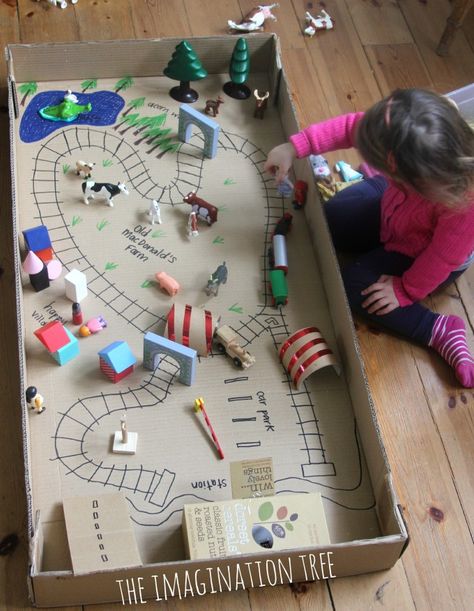 Train Tracks Small World in a Cardboard Box - The Imagination Tree Diy Cardboard Toys, Cardboard Play, Imagination Tree, Cardboard Toys, Small World Play, Diy Cardboard, Cardboard Crafts, Small World, Diy Toys