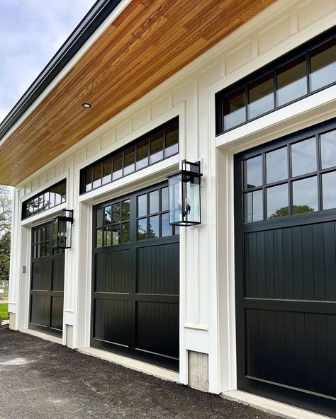 Black Wood Garage Doors, Black Double Garage Doors, Modern Farmhouse Garage Doors Black, Garage Doors Modern Farmhouse, Black Garage Doors With Windows, Black Garage Door With Windows, Garage Doors On White House, White Oak Garage Door, Black Garage Doors White House