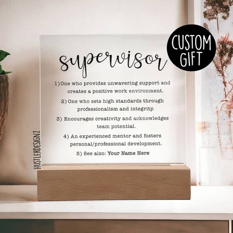 Introducing our heartfelt Supervisor Definition Personalized Plaque, a perfect gift that pays tribute to the incredible impact of the leaders and mentors in our lives. This versatile plaque can be given to both men and women, making it a thoughtful and inclusive gift idea for any leader. Why We Think You'll Love This Plaque: 👍 Personalized Touch: Customize with the recipient's name and/or a special message for a truly unique and meaningful gift. 👍 LED Base Options: Choose between a USB plug-in LED base or a cordless battery-operated LED base (requires 2 AAA batteries, not included). Both bases feature 7 vibrant colors and dynamic lighting cycles. 👍 High-Quality Materials: Made from durable acrylic for a sleek and polished look. Product Specifications * Total Dimension with wooden base: Supervisor Gifts Ideas, Supervisor Gifts, Positive Work Environment, Personalized Plaques, Team Leader, Diy Dress, Appreciation Gifts, Thank You Gifts, Meaningful Gifts