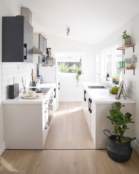 11 Galley Kitchen Redesign Ideas That Are Full of Flavor | Hunker Galley Kitchen Cabinets, Ikea Galley Kitchen, White Galley Kitchens, Small Galley Kitchen Designs, Small Galley Kitchen, Kitchen Triangle, Galley Kitchen Design, Galley Kitchen Remodel, Galley Kitchens