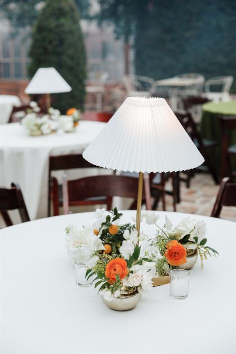 This wedding at Race and Religious was a visual delight! Orange pops in the centerpieces and green and white linens made a beautiful statement. Lamps on tables added a warm, comforting touch, enhancing the courtyard’s natural beauty with sophistication and charm. Lamp Centerpiece Wedding, Wedding Cocktail Hour Decor, Green And Yellow Wedding, Statement Lamps, Lamp Centerpiece, Malibu Elopement, Cocktail Hour Decor, Wedding Boards, Wedding Ambiance