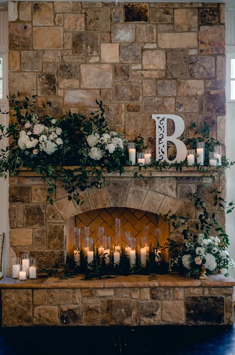 Romantic Sunday Wedding at Little River Farms | Milton, Georgia | Candles in wedding fireplace and lots of greenary and flowers Rustic Fireplace Wedding Decor, Wedding Backdrop Fireplace, Mantel Decor For Wedding, Mantle Decor Wedding Fireplace, Fireplace Wedding Ceremony Mantels, Fireplace Mantle Decor Wedding, Fireplace Decor Wedding Receptions, Sweetheart Table In Front Of Fireplace, Fireplace Mantel Wedding Decor