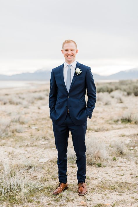 Groom with navy blue suit, light blue tie and brown shoes and belt  Dreamy Winter Bridal Session at Antelope Island || Utah Wedding Photographer || Syracuse, Utah || Photography by Tasha Rose Navy Blue Suit With Dusty Blue Tie, Navy Suit Winter Wedding, Navy Blue Suit Light Blue Tie, Navy Blue Suit With Brown Shoes, Navy Suit Dusty Blue Tie, Black Tux With Light Blue Tie, Navy Suit Brown Shoes Wedding, Navy Suit With Blue Tie, Ties With Navy Suits