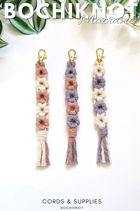 Macrame keychains are a beautiful and functional accessory that can be customized to fit any style. From simple designs to intricate patterns, the possibilities are endless. With a variety of knotting techniques and high-quality macrame cord, creating a unique and personalized keychain is easier than ever. Add some charm and character to your keys with a handmade macrame keychain that reflects your personal style. Macrame Daisy Keychain, Macrame Daisy, Daisy Keychain, Keychain Macrame, Macrame Wall Hanging Tutorial, Creative Origami, Simple Macrame, Diy Fabric Jewellery, Boho Keychain