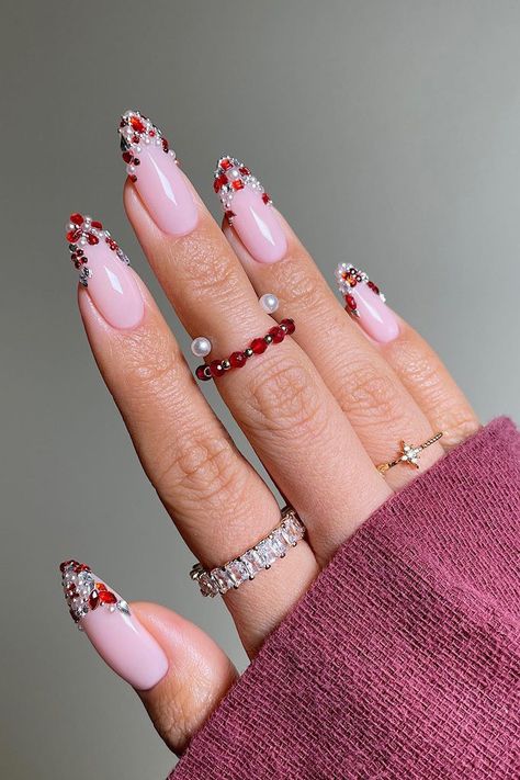 Gemstones Nail Design, Red Gemstone Nails, Rhinestone And Pearl Nails, Winter Nails With Gems, Jewel French Tip Nails, Gem Christmas Nails, French Nails With Gems Rhinestones, Pearl Christmas Nails, Gemstone Nail Designs