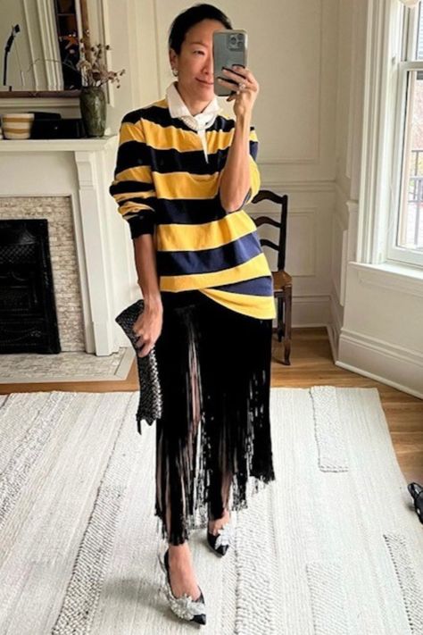 woman wearing a rugby shirt with fringe skirt Women Rugby Shirt Outfit, Oversized Rugby Shirt Outfit Women, Oversized Outfit Women, Rugby Shirt Outfit Women, Rugby Shirt Outfit, Oversize Outfit, Interesting Outfits, Autumn 2024, Style Looks