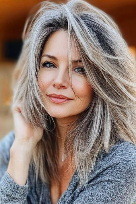 25 Flattering Medium Styles That Minimize Face Sagging Layered Gray Hair Over 50, Long Gray Hair Over 50, Hair Long Layers, Gray Hair Long, Wavy Layered Hair, Sagging Face, Long Grey Hair, Gray Highlights, Grey Hair Over 50