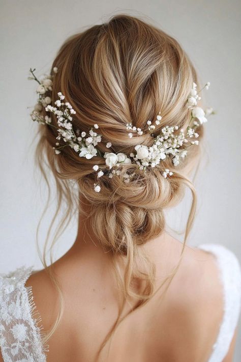 Give your bridal hair an ethereal touch with these 51 stunning ideas featuring floral charm. From flower-embellished buns to cascading blooms, these hairstyles capture timeless beauty. No matter your wedding vibe, these floral looks will enhance your style. Find your inspiration today! #bridalflowers #weddinghairinspo #floralvibes Enchanted Wedding Hairstyles, Wedding Hair Accessories For Bride, Traditional Bride Hairstyle, Baby Breath Hair Piece, Wedding Updo Flowers, Low Bun Wedding Hair With Flowers, Wedding Hair Balayage, Baby Breath Hairstyles, Short Hair Bride Hairstyles With Veil