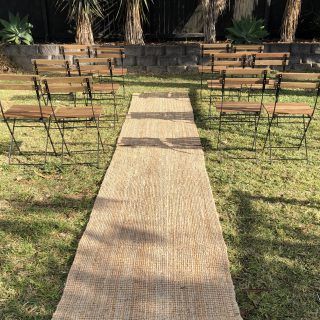 Jute Aisle Runner Wedding, Turf Wedding Aisle, Isle Runner Ideas Outside, Burlap Isle Runners, Boho Carpet Wedding Aisle, Jute Rug Aisle Runner Wedding, Wedding Aisle Rug Runners, Wedding Runway Aisle Outdoor, Jute Rug Wedding Ceremony