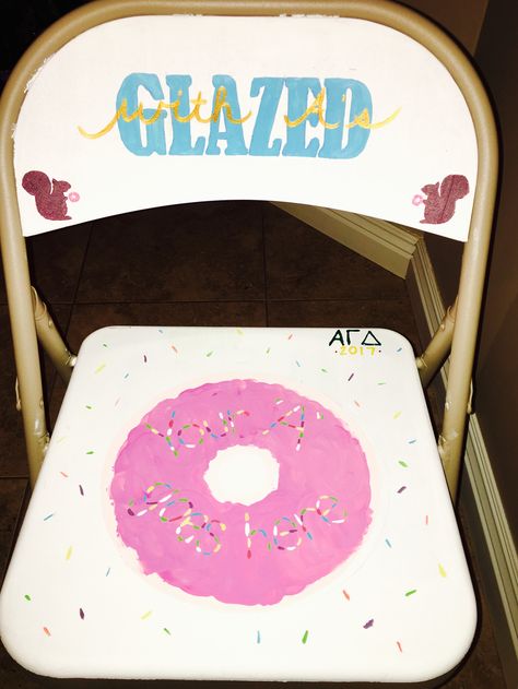 "Glazed with A's" is a study incentive for Alpha Gamma Delta. A seat in a pretty chair with a dozen donuts 🍩 #AGD #alphagammadelta #donuts #sorority Sorority Academic Chair Ideas, Whimsical Chairs, Donut Decor, Pajama Birthday Parties, Dozen Donuts, Pancakes And Pajamas, Donut Decorations, Chair Ideas, Alpha Xi Delta