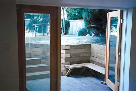 Kitsilano basement entrance- including retaining wall and doors. Walkout Basement Door Ideas, Basement Door Ideas, Patio Ingles, Minneapolis Miracle, Basement Home Office, Basement Door, Industrial Basement, Window Wells, Basement Suite