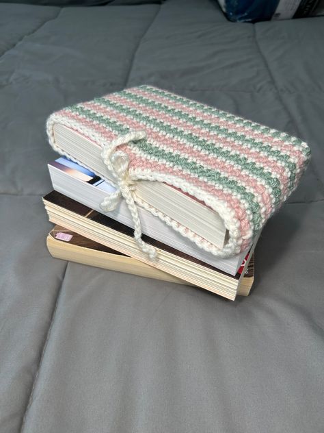 This crocheted book sleeve can fit most paperbacks and some smaller hardbacks. Book Sleeve Crochet, School Crochet, Crochet Book Sleeve, Crochet Book Cover, Book Sleeves, Popsicle Crafts, Crochet Case, Crochet Book, Kindle Cover