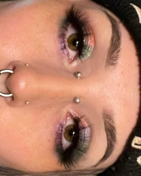 glittery assymetrical rainbow grungey makeup alt girl bridge piercing symmetrical nose piercings by tessahazzard on ig Symmetrical Facial Piercings, Symmetrical Piercings, Bridge Piercings, Septum And Bridge Piercing, Both Nostrils Pierced With Septum, Septum And Nose Bridge Piercing, Nose Bridge Piercing, Alt Face Peircings, Bridge Piercing