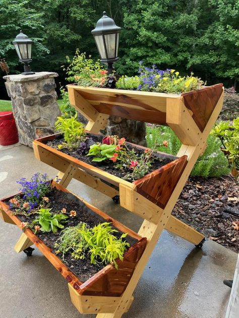 This planter box setup is great for those with not a lot of space and would still like to grow herbs. It is definitely an eye-catcher for anyone's deck, patio, or balcony. The base is made with pine with an exterior paint while the boxes are made with cedar to grow your herbs without any chemicals or contaminants. Approximately 30 x 34 x 40. Locking Wheels can be added to help with mobility if you need to move it around. Garden Planter Boxes Raised, Herb Shelf Outdoor, Diy Planter Boxes Outdoor, Lanai Makeover, Tiered Planter Boxes, Kitchen Herb Garden Ideas, Herb Planter Ideas, 3 Tier Planter, Patio Features