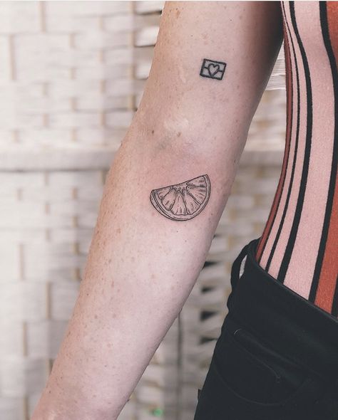 Orange slice tattoo Tattoos Of Oranges, Tangerine Slice Tattoo, Simple Orange Slice Tattoo, Orange Slice Tattoo Traditional, Orange Half Tattoo, Orange Fruit Tattoo Black And White, Tattoo Of An Orange, Orange Line Tattoo, Orange Juice Box Tattoo