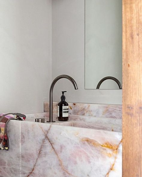 CDK Stone on Instagram: "Rosa Calmante has been used throughout the home of AFLW star Katie Brennan and partner Olivia Christie's with a feature vanity in the bathroom.⁣ Designed by @bergmanandco ⁣⁣ Image by @nataliejeffcott ⁣⁣ ⁣⁣ #cdkstone #rosacalmante #naturalstone #naturalbeauty #naturesmasterpiece #designstyle #natural #stone #interiors #exteriors #designinspo #designinspiration #natural #interiors #stone #interiordecor #designoftheday" Pink Marble Sink, Rose Quartz Bathroom, Pink Marble Bathroom, Bathroom Bench, Natural Interiors, Quartz Bathroom, Stone Bathroom Sink, Quartz Sink, Stone Vanity