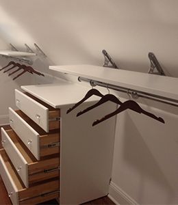 Angled Closet Ideas Sloped Ceiling, Slanted Closet Ideas, Slanted Wall Closet, Long Narrow Closet, Slanted Ceiling Closet, Closet Rod Bracket, Angled Wall, Narrow Closet, Attic Bedroom Storage