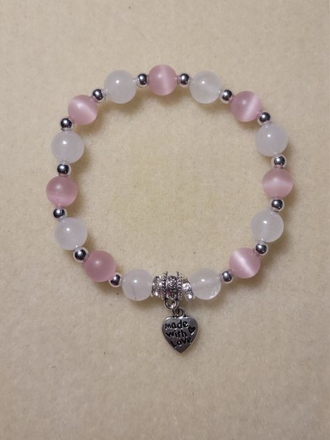 "Hand-made pink and white bracelet. Pink and white 8mm glass beads separated by silver spacers.  \"Made with Love\" charm added. Charm can be customized." Cute Cheap Bracelets, 8mm Beads Bracelets, 8mm Bead Bracelet, Glass Beaded Bracelets Aesthetic, Beaded Bracelets 8mm, Pink And White Beaded Bracelets, Bracelets Of Beads, Braslets Designs Beads, Pink And White Accessories