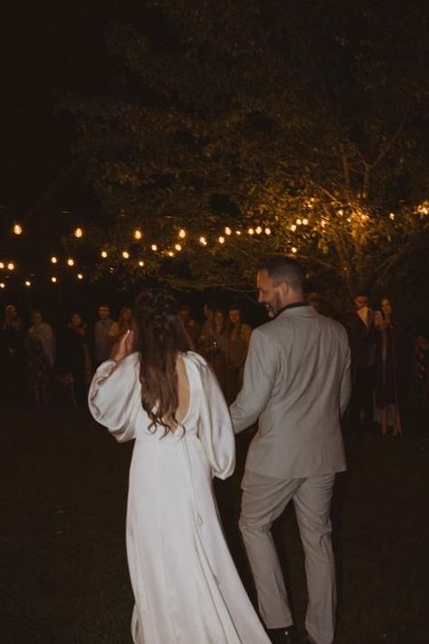 backyard post elopement party, father daughter dance outside with patio string lights. bride wearing long sleeve wedding dress by Watters Post Elopement Party Backyard, Surprise Elopement Party, Backyard Elopement Party Receptions, Wedding Party After Elopement, Elopement Party Receptions, Elopement Party Backyard, Elopement After Party Ideas, Post Elopement Party Ideas, Post Elopement Reception