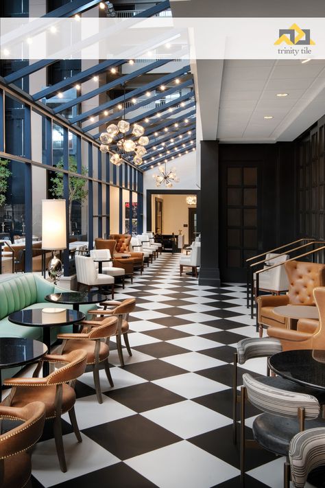 Craig and Amy Smith with Portfolio for Hospitality chose Trinity Tile products for the majority of hardscapes in this upscale hotel. Our wood look tile is your first impression in the lobby in a pleasing herringbone pattern. The onsite restaurant, Ruth Chris, has a stunning black and white checkerboard pattern for a modern take on a classic aesthetic.#tilepatterns #designandarchitecture #flooringspecialist #interiorroom #flooringtiles #tilelover #tilegeeks #tilefloor #interiorsdesign #newfloors Black And White Floor Restaurant, Tile Inlay, Ruth Chris, Cotton Mill, White Tile Floor, Embassy Suites, Hotel Luxury, Classic Aesthetic, Black And White Tiles