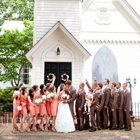 The bridesmaids wore knee-length dresses in a fresh coral color while the groomsmen wore brown suits accented with champagne ties. Wedding Colors Coral, Brown Groomsmen, Brown Bridesmaid Dresses, Groom And Groomsmen Suits, Coral Bridesmaid Dresses, Champagne Bridesmaid Dresses, Champagne Bridesmaid, Country Chic Wedding, Brown Wedding