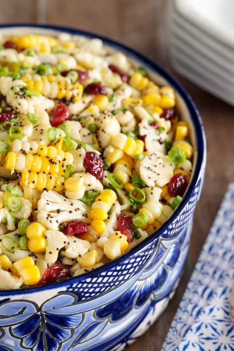 Loaded with healthy veggies, this Cauliflower and Fresh Corn Salad is crunchy and delicious. A sweet, tangy poppyseed dressing adds fabulous flavor! #rawvegetablesalad, #cauliflowersalad, #freshcornsalad, #healthyvegetablesalad, #saladwithpoppyseeddressing Raw Vegetable Salad, Healthy Vegetable Salad, Fresh Corn Salad, Poppyseed Dressing, Summer Corn Salad, Cauliflower Salad, Healthy Veggies, Raw Vegetables, Corn Salad