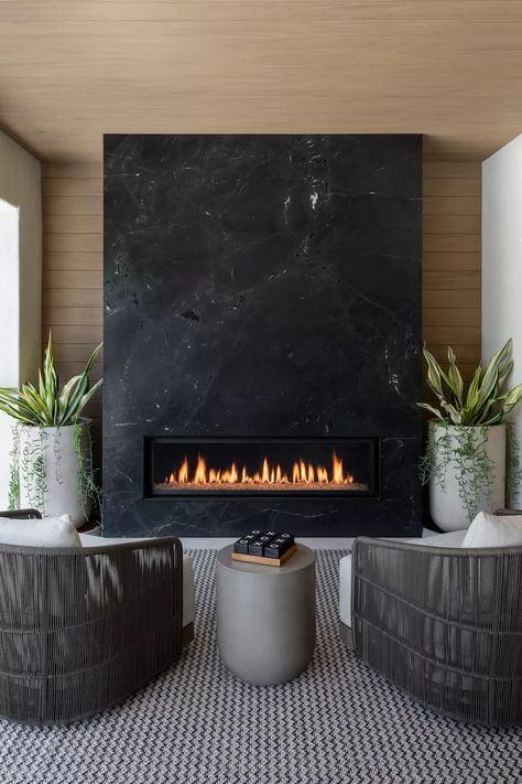 25 Outdoor Fireplace Ideas That Are Warm and Cozy Outdoor Tiled Fireplace, Linear Fireplace Tile Surround, Dekton Fireplace, Dark Fireplaces, Black Modern Fireplace, Fireplace Wall Ideas With Tv, Black Fireplaces, Black Marble Fireplace, Slate Fireplace Surround