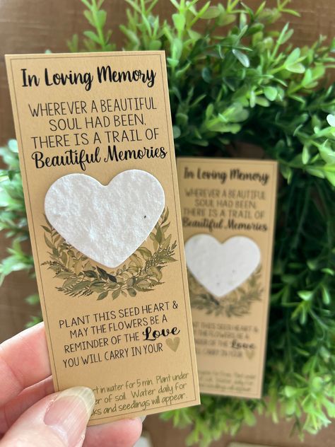 SWEET THOUGHTS - Plantable Seed Heart Bookmarks  - IN LOVING MEMORY  Need a unique & beautiful idea to send a loved one after a loss?  Include our IN LOVING MEMORY Bookmarks with a sympathy card or hand out to guests. This listing is for : 1 or more   Plantable , seed filled heart shapes.  - IN LOVING MEMORY BOOKMARKS - 1 & 3/4 inches wide x 4 & 3/4 inches tall. Instructions for planting the Flower Seed shapes are on the bottom of the cards Our seed paper is from BLOOMIN.  It is bio-degradable, Celebration Of Life Seed Packets, Celebration Of Life Ideas Diy, Unique Celebration Of Life Ideas, Evermore Quotes, Obituaries Ideas, 50th Class Reunion Ideas, Unique Sympathy Gifts, Easy Teacher Gifts, Memorial Favors