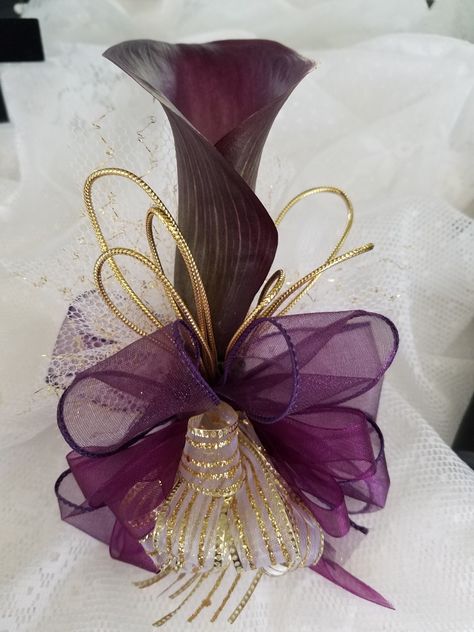 Plum purple calla lily wrist corsage with gold accents Wakanda Wedding, Purple Calla Lily, Gold Corsage, Purple Calla Lilies, Wrist Corsage, Plum Purple, Calla Lily, Boutonniere, Gold Accents