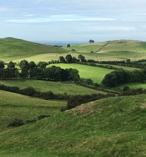 The many shades of green in an Irish countryside speak to me of Spring. The sea is visible in the distance as your gaze takes you past the gently rolling hills…a quintessential scene of pastoral beauty. Behind me on a high hill sits an ancient Irish Passage Tomb holding the secrets of the early people who made their homes in this beautiful land. Ancient Irish, Cityscape Drawing, Speak To Me, Irish Countryside, Irish Landscape, Irish Cottage, Hills And Valleys, Countryside Landscape, Ancient Forest