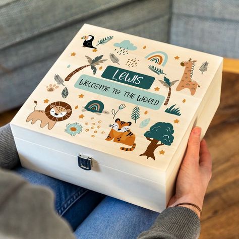 "This personalised new baby keepsake box is the perfect gift to celebrate the arrival of a new baby! The keepsake box is printed with a full colour jungle animals design and includes any personalised text. This keepsake box is ideal for collecting all of those important momentos such as photos and other important items that we wouldn't want to misplace. Often given as part of a new baby, this wooden box can be filled with wonderful gifts and then can be emptied and refilled with special trinkets Homemade Coasters, Baby Memory Box, Wooden Wedding Guest Book, Wooden Memory Box, Baby Keepsake Box, Gift For Newborn, Baby Gift Hampers, Animals Design, Wooden Keepsake Box