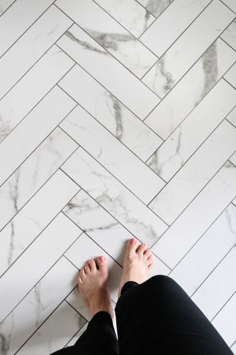 faux marble herringbone tile floor with gray grout Small Shower Renovation, Herringbone Tile Shower Wall, Shower Marble Tile, Marble Tiles Kitchen, Herringbone Shower Floor, Marble Tile Shower, Marble Herringbone Floor, Shower Marble, Herringbone Tile Bathroom