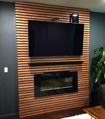 Tv Accent Wall, Gods Of Olympus, Deco Tv, Basement Fireplace, Feature Wall Living Room, Fireplace Tv Wall, Basement Living Rooms, Wood Slat Wall, Wood Accent Wall