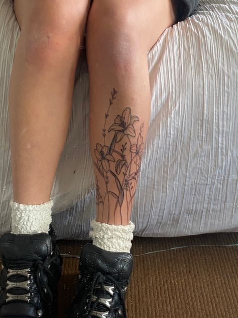 Tatoos Legs Woman, Illustrative Floral Tattoo, Lower Leg Flower Tattoo, Barbed Wire Leg Tattoo, Leg Tattoo Pieces, Flowers On Ankle Tattoo, Flowers On Leg Tattoo, Pretty Tattoo Placement, Flowers Around Ankle Tattoo