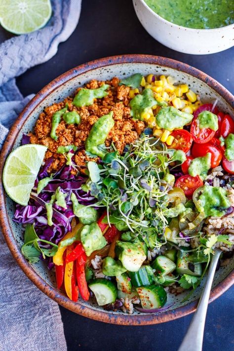 Better than Chipotle, this burrito bowl recipe is easy and delcious! It's made with seasoned rice and black beans (cooked in one pot) with fresh veggies and toppings,  optional sofritas, and a creamy avocado sauce! Vegan and Gluten-free. Rice And Black Beans, Burrito Bowl Recipe, Chipotle Burrito Bowl, Chipotle Burrito, Burrito Bowls Recipe, Creamy Avocado Sauce, Veggie Burrito, Vegan Buddha Bowl, Cilantro Sauce