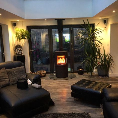 Contemporary wood burner installed in orangery Conservatory Fire Log Burner, Conservatory Wood Burner, Wood Burner In Conservatory, Kitchen Woodburner, Free Standing Log Burner Living Rooms, Living Room Patio Doors, Corner Wood Stove, Conservatory Living Room, Kitchen Orangery