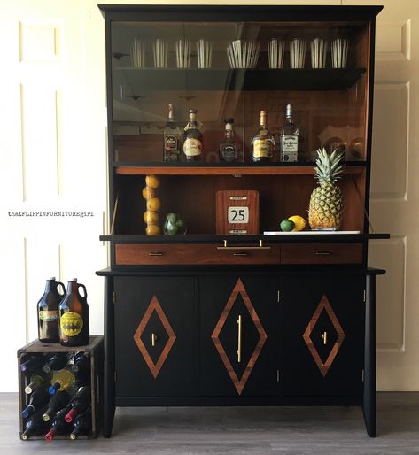 Mid Century Modern China cabinet turned Swanky Bar with the addition of a drop down door. Finished with General Finishes Lamp Black Milk Paint and Nutmeg Gel Stain Bar China Cabinets, Mid Century Cabinet Makeover, China Cabinet Flip, Upcycled Bar Cabinet, Refurbished Bar Cabinet, China Cabinet To Bar, Curio Cabinet Bar Makeover, Taupe China Cabinet, China Cabinet Turned Into Bar