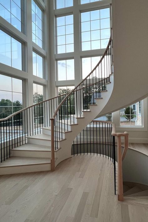 Stair Towers Staircase With Windows, Stairs With Big Window, Large Window Staircase, Hallway With Windows, Round Stairs Design, Statement Staircase, Staircase Windows, Curvy Staircase, Slightly Curved Staircase