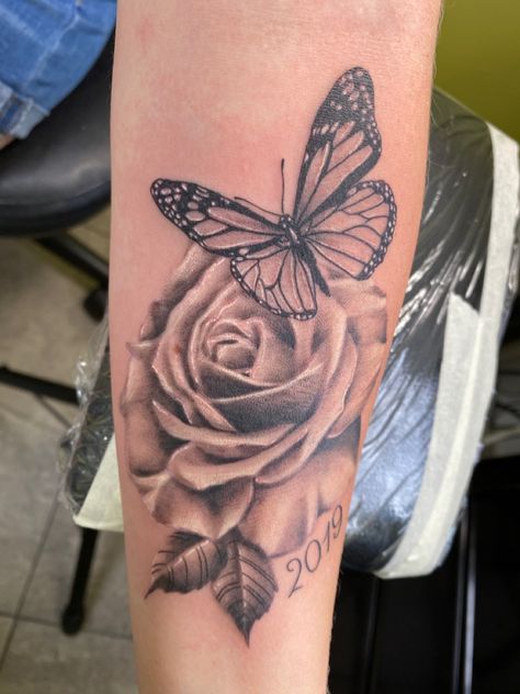 Butterfly for my sister Ashley & Rose for my mother-in-law Angie with 2019 for the year that both of them passed away. Butterfly And Roses Tattoo For Women, Memorial Tattoo With Flowers, Flower And Butterfly Tattoos For Women, Tattoo Ideas Female Rose And Butterfly, Butterfly Tattoo In Memory Of, Rose And Butterfly Tattoo On Shoulder, Roses With Butterfly Tattoo, Butterfly Memorial Tattoo Mom, Rose Arm Tattoos For Women Forearm