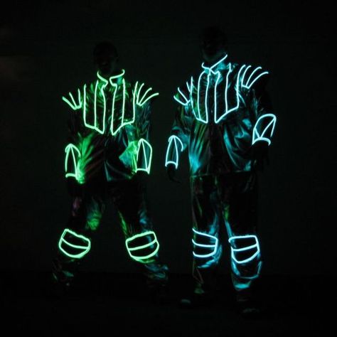 Instructable from creator of Daft Punk's EL Wire suits.  Picture of other examples: EL wire suits El Wire Costume, Led Outfit, Electroluminescent Wire, Led Costume, Sweat Noir, E Textiles, Led Clothing, Club Clothes, Dark Party